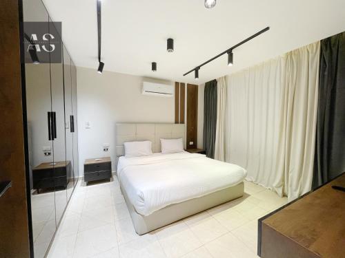 Katil atau katil-katil dalam bilik di Alshemy Serviced Apartments