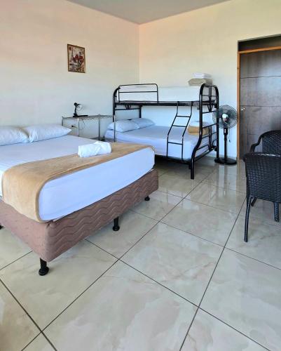Ein Bett oder Betten in einem Zimmer der Unterkunft Hostel Cattleya - Monteverde, Costa Rica