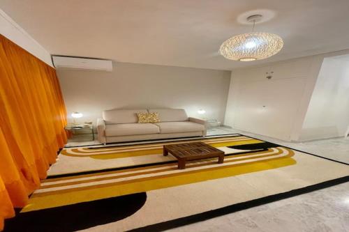 a living room with a couch and a coffee table at Studio in Antibes near La Salis Beach in Antibes
