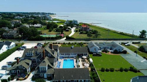 an aerial view of a house with a pool and the ocean at Beach Breeze Inn in Falmouth
