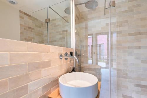 a bathroom with a sink and a shower at ON Apartments - Cozy - Free Parking & Pet Friendly in Porto