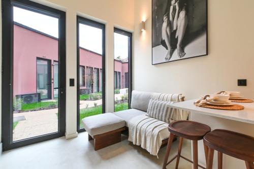 a living room with a couch and a table at ON Apartments - Cozy - Free Parking & Pet Friendly in Porto