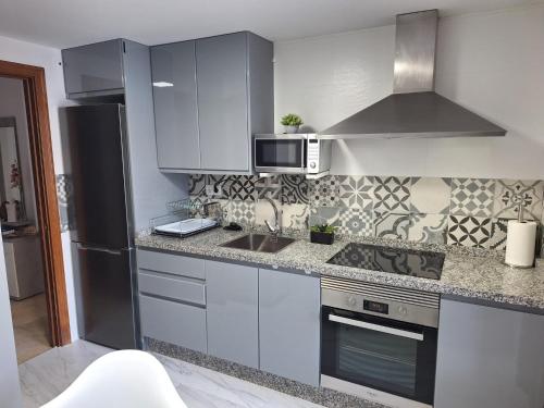 Køkken eller tekøkken på ATICO VISTA ESURI GOLF y RELAX