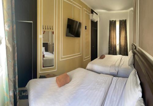 Katil atau katil-katil dalam bilik di Kulon Progo INN Bandara YIA Hotel