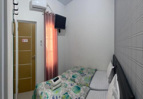 Katil atau katil-katil dalam bilik di Kulon Progo INN Bandara YIA Hotel