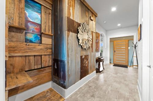 a hallway with a wall of reclaimed wood at Nancy Key in Terrell