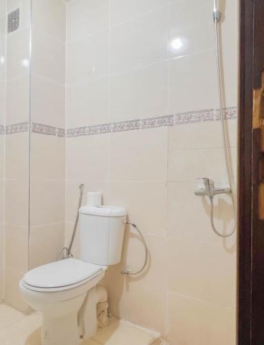 a bathroom with a toilet and a shower at Appart Hotel Fes - Joud Families & Travelers in Fès
