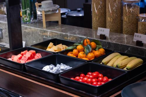 a display of fruits and vegetables in black containers at Atour Hotel Canton Tower Pearl River Binjiang Road East Guangzhou - Free Shuttle Bus Service Between Fair And Hotel During The Canton Fair in Guangzhou