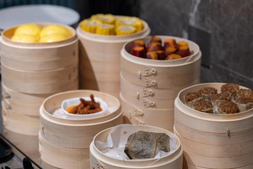 a group of barrels filled with different types of food at Atour Hotel Canton Tower Pearl River Binjiang Road East Guangzhou - Free Shuttle Bus Service Between Fair And Hotel During The Canton Fair in Guangzhou