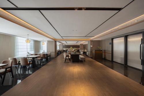 a large room with tables and chairs and a cafeteria at Atour Hotel Canton Tower Pearl River Binjiang Road East Guangzhou - Free Shuttle Bus Service Between Fair And Hotel During The Canton Fair in Guangzhou