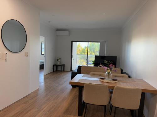 a living room with a table and a couch at Shoreline Bliss in South Beach