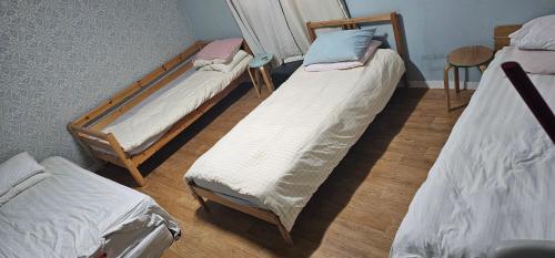 Giường trong phòng chung tại 24 Guesthouse Gangnam Center - Female only