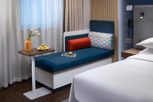 Postel nebo postele na pokoji v ubytování Holiday Inn Express Changsha South Railway Station by IHG