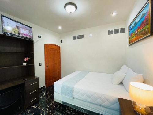 Giường trong phòng chung tại Casa El Borde Del Lago