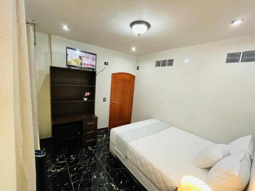 Giường trong phòng chung tại Casa El Borde Del Lago