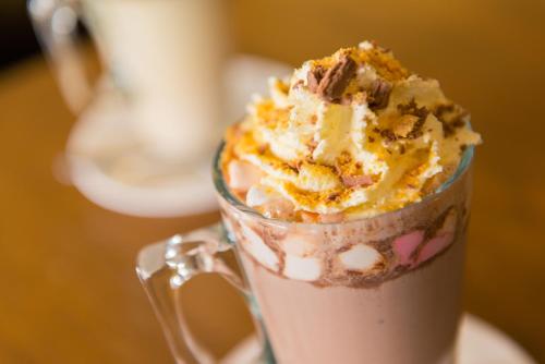 a glass cup filled with ice cream and cookie chunks at Lake Vyrnwy Hotel & Spa in Llanwddyn