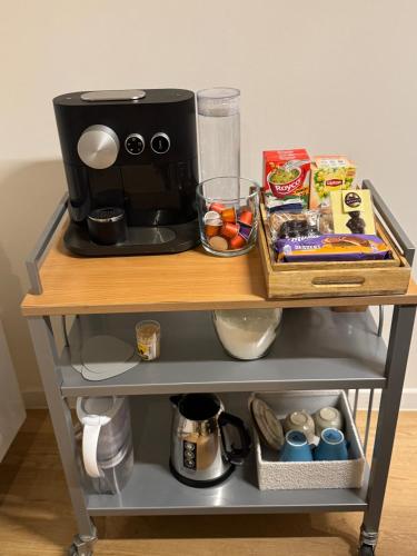 a table with a coffee maker on top of it at DePearl in Brussels
