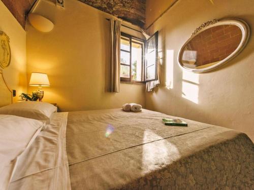 a bedroom with a bed with a stuffed animal on it at Agriturismo Tenuta Quarrata Santo Pietro Belvedere in Ripoli