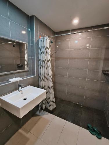 a bathroom with a sink and a shower at Grand Horizon Imperium Residence Kuantan Studio City view in Kuantan