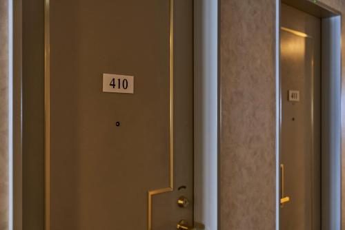 a door with the number in a room at Hotel Global View Hachinohe Annex in Hachinohe