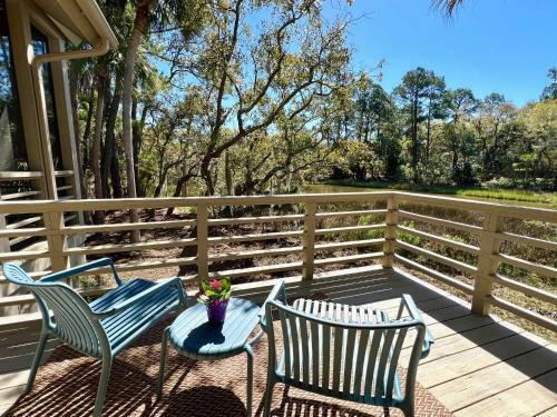two chairs and a table on a deck at 2975 Deer Point Dr in Johns Island