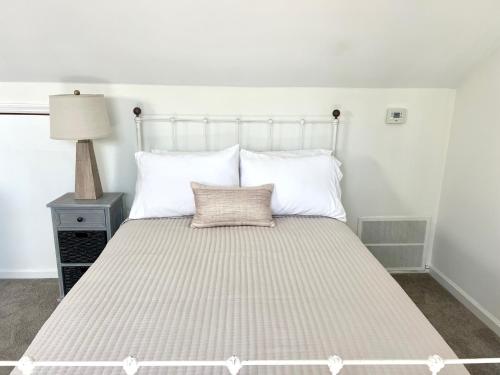a large bed with white pillows in a bedroom at 2975 Deer Point Dr in Johns Island