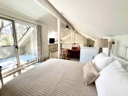 a bedroom with a bed and a large window at 2975 Deer Point Dr in Johns Island