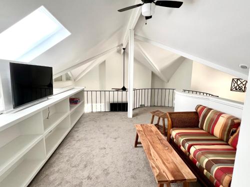 a living room with a couch and a flat screen tv at 2975 Deer Point Dr in Johns Island