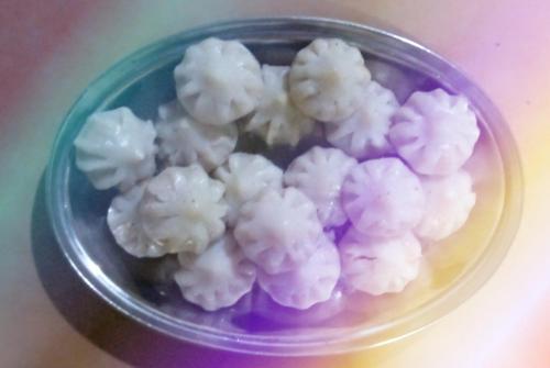 a glass bowl filled with cauliflower on a table at Holiday Home Beach Resort And Aquatic Sports In Tarkarli in Malvan