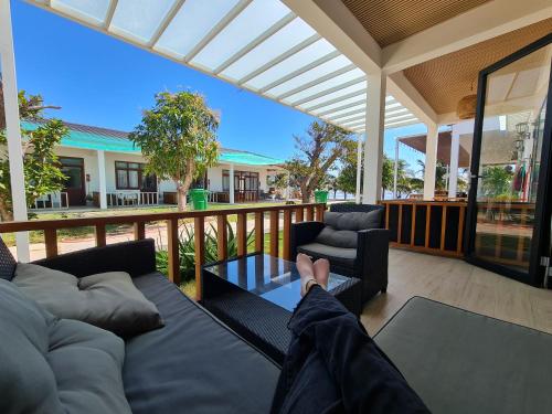 a person laying on a couch on a porch at Myhoa Lagoon - Kiting Town in Phan Rang