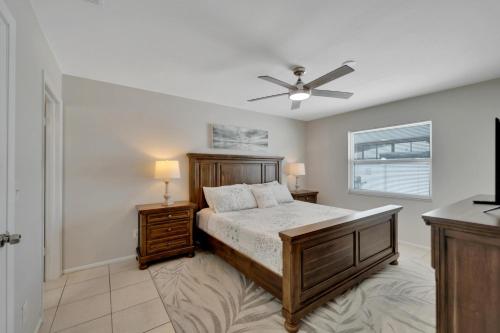 a bedroom with a bed and a ceiling fan at 1053 Apollo Beach Blvd Unit 5 in Apollo Beach