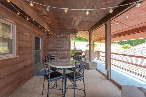 a patio with a table and chairs on a porch at Lake Hickory Trio 2BR Green Unit in Hickory