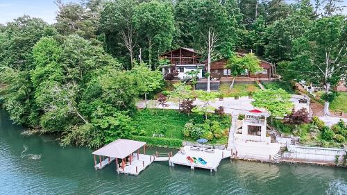 an aerial view of a house on the water at Lake Hickory Trio 2BR Green Unit in Hickory