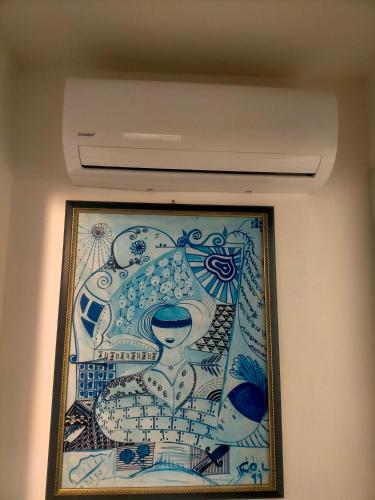 a painting on a wall in a room at Kinghouse in Domodossola