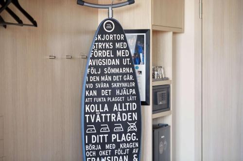 a sign hanging from a wall with words on it at Scandic Hamburg Emporio in Hamburg