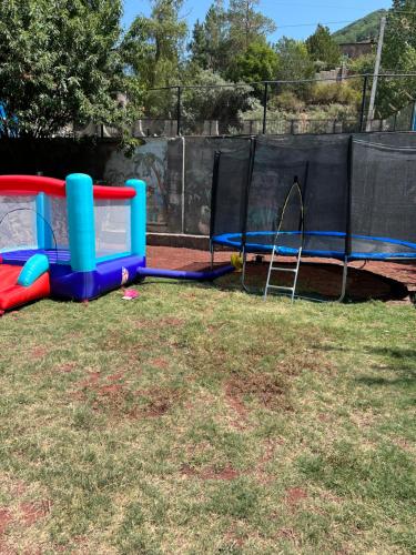 a playground with two play equipment in a park at Golden Gate Resort in Agveran