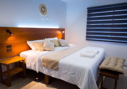 Postel nebo postele na pokoji v ubytování Coral Apartments