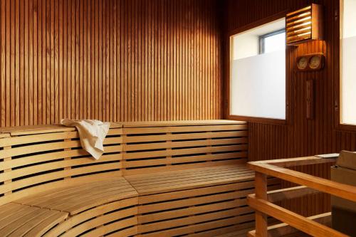 a sauna with a bed in a wooden room at Scandic Copenhagen in Copenhagen