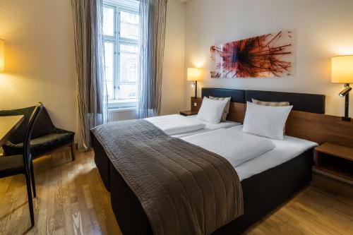 a bedroom with a large bed in a room at Scandic Webers in Copenhagen