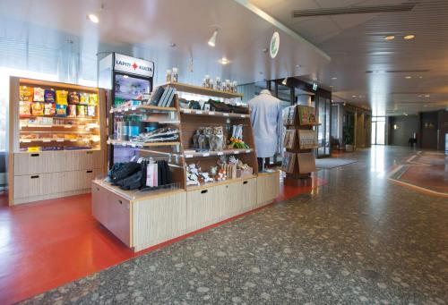 a store with a mannequin in the middle of a mall at Scandic Kuopio in Kuopio