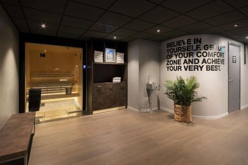 a room with a large sign on the wall at Scandic St. Olavs Plass in Oslo