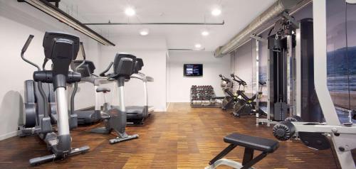 a gym with treadmills and exercise bikes in a room at Scandic Stavanger Forus in Stavanger