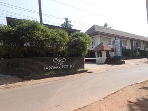 a sign for a saphan korat hotel on a street at Sobit Sarovar Portico in Palolem