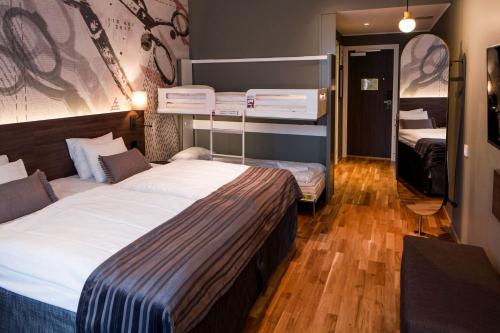 a hotel room with two bunk beds in it at Scandic Plaza Borås in Borås