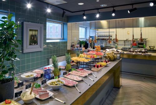 a buffet line with many different types of food at Scandic Rubinen in Gothenburg