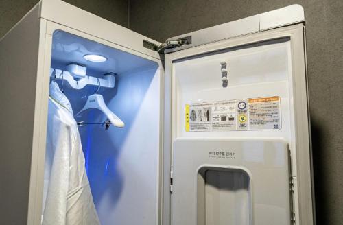 a refrigerator with a sign on the side of it at Moonstay Hotel Cheonan in Cheonan