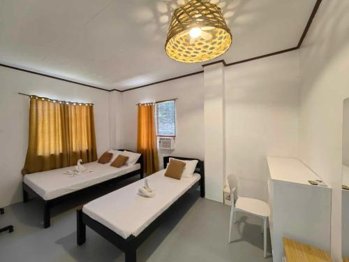 Katil atau katil-katil dalam bilik di Fredo's Guest House at Pangpang Bar & Restaurant