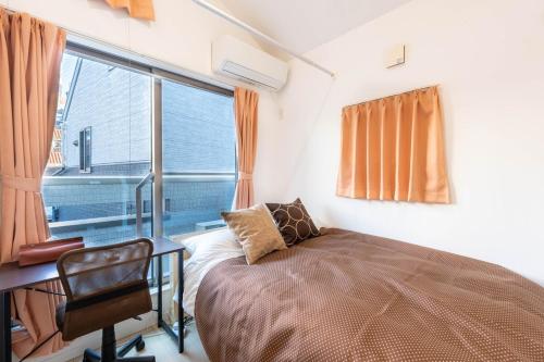 Postel nebo postele na pokoji v ubytování 夢の宿 翼 132t