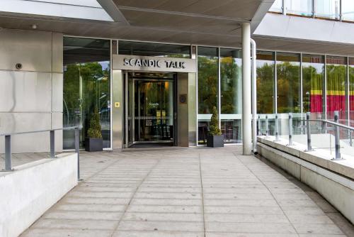 a building with a sign that reads sanchez walk at Scandic Talk in Stockholm