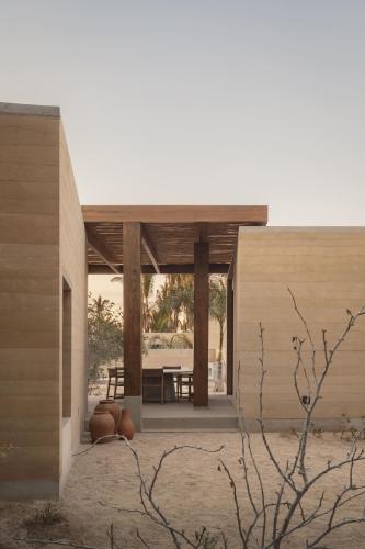 a house in the desert with a pavilion at Salara in Todos Santos